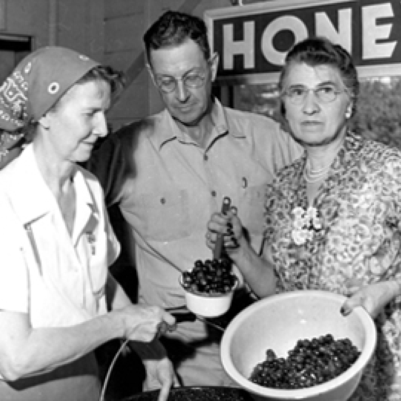 three people with berries